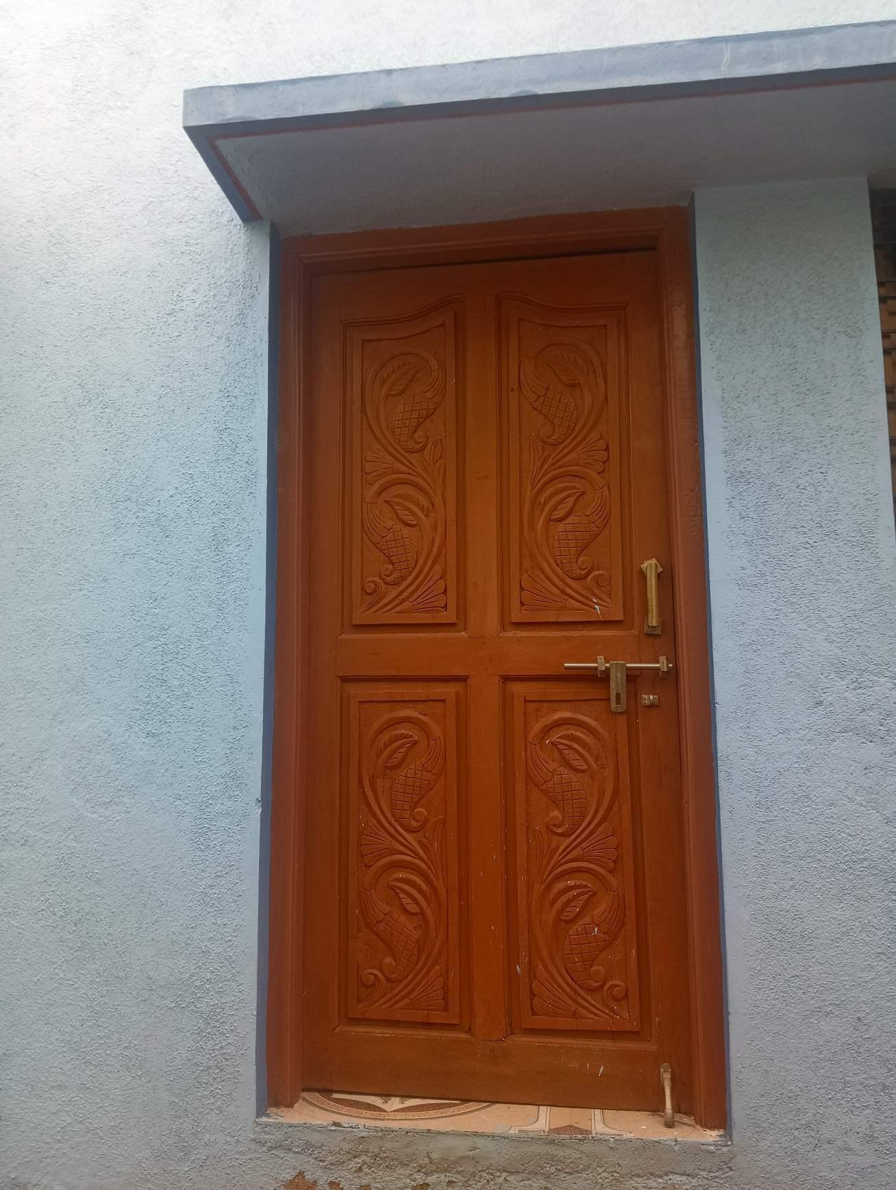 Wooden door featuring intricate carvings. (Source: CKA Archives)