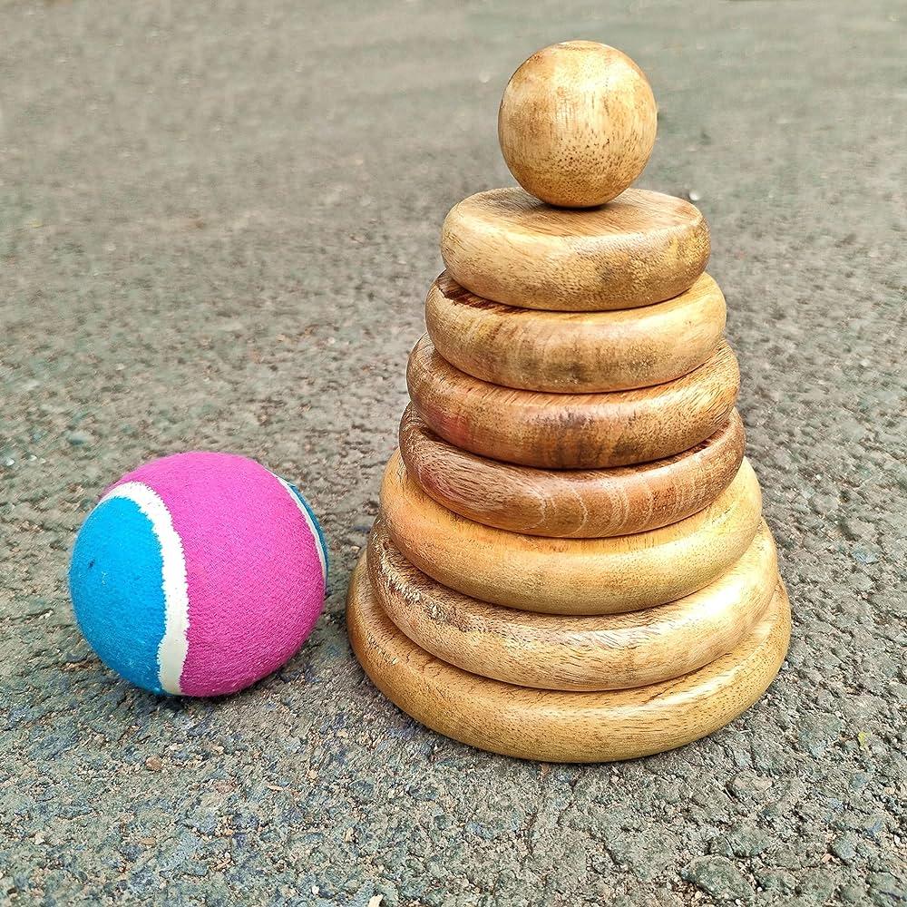 In the Lagori game, a ball made of plastic or rubber and seven flat stones or discs are used (Source: CKA Archives).