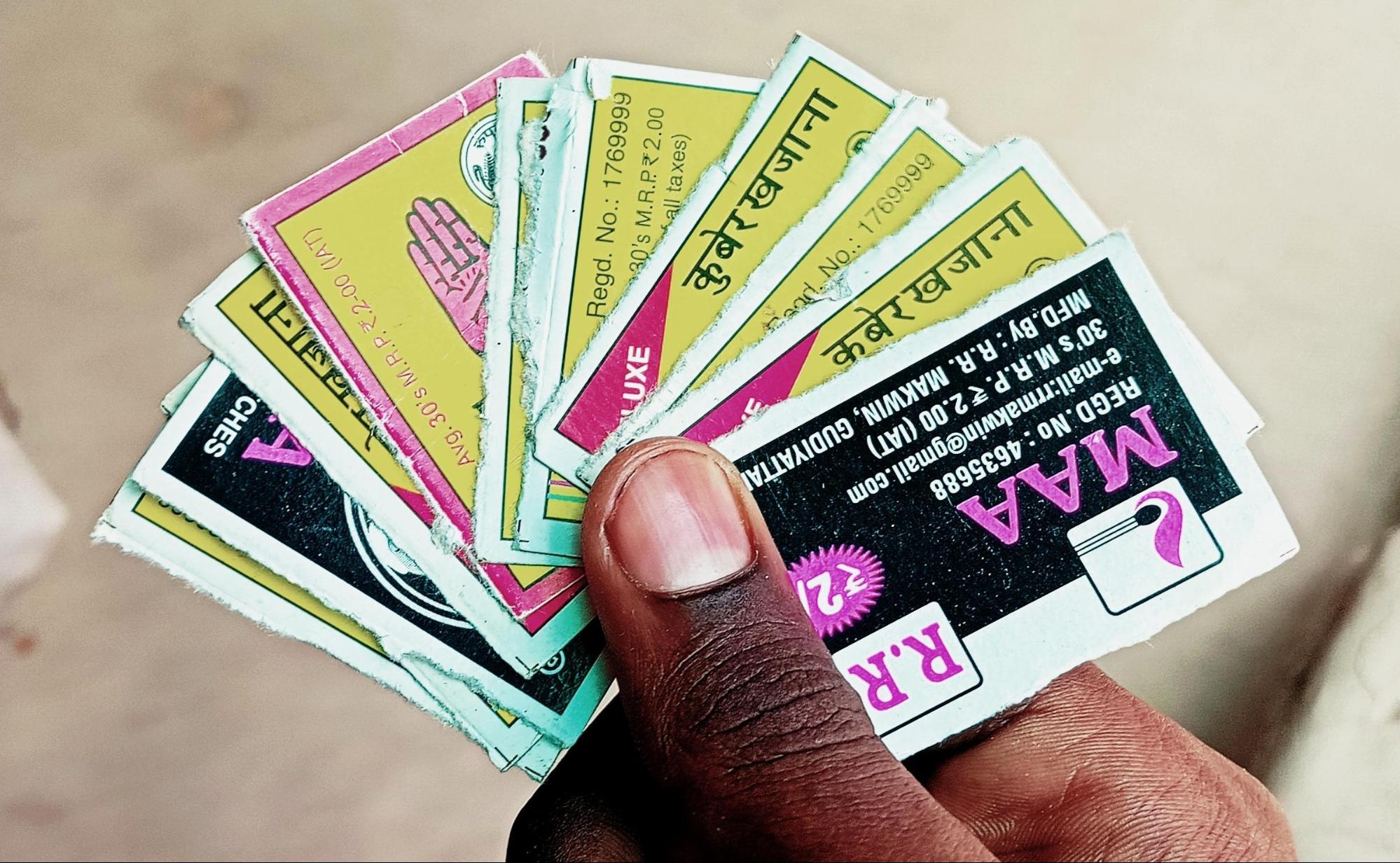 Sticker is a game played using the colorful cards found inside matchboxes, such as those from brands like Kuber-Khajana, Panjah, and Camel (Source: CKA Archives).