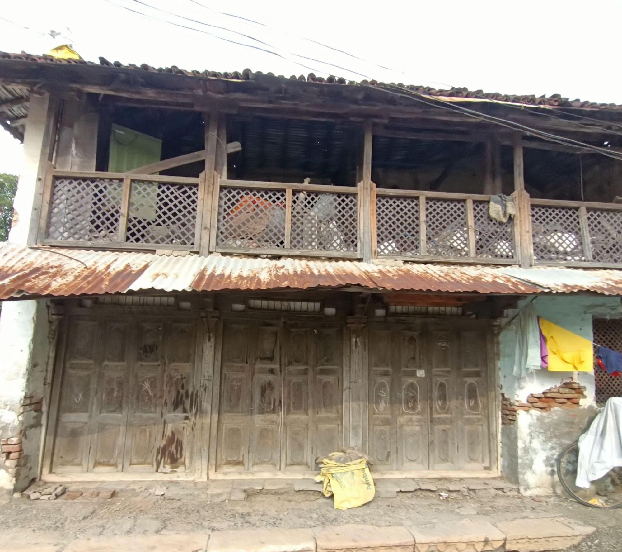 A contrasting corner of the residence, featuring exposed wooden construction and detailing. (Source: CKA Archives)