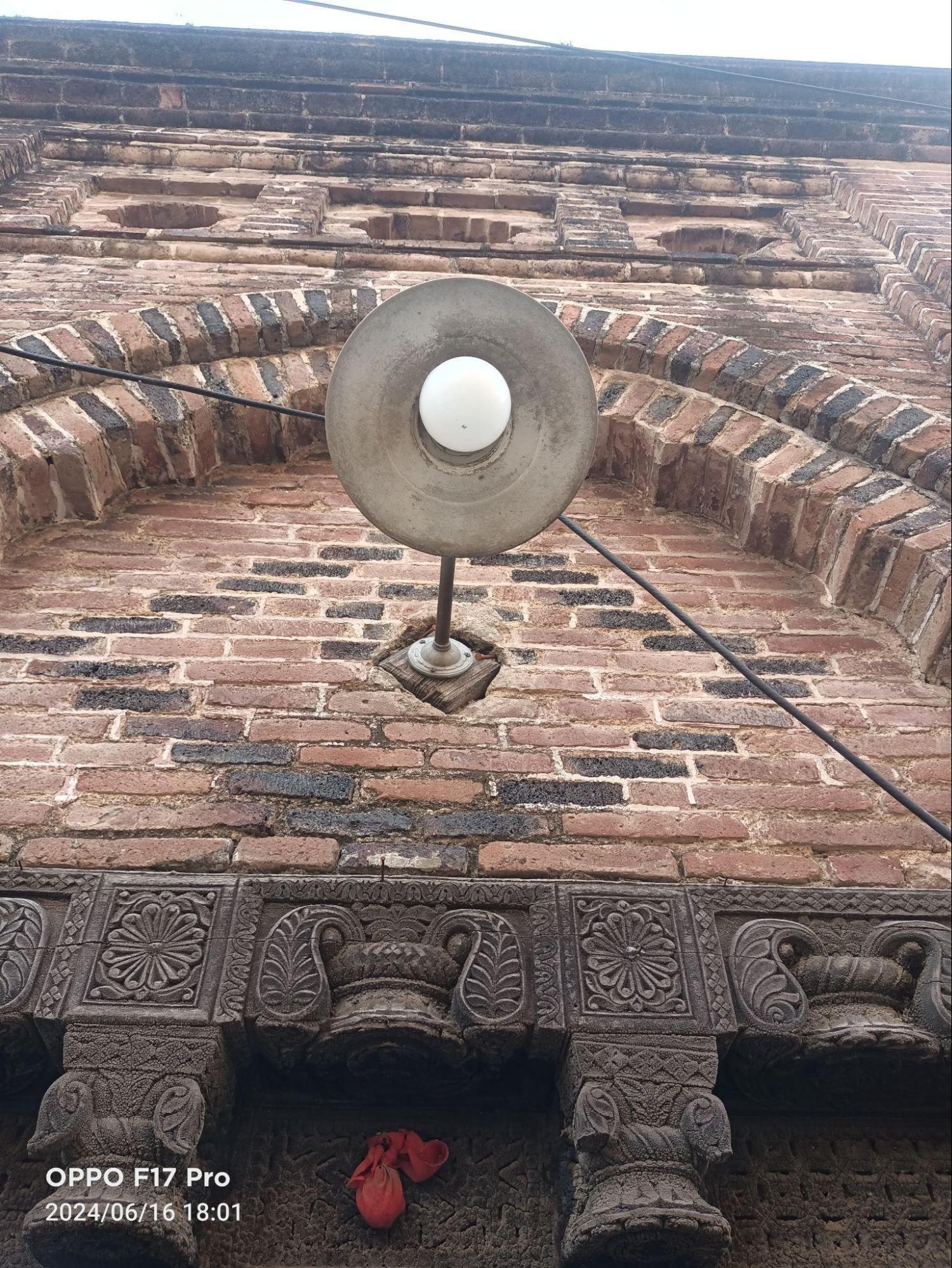 A distinct cornice detail positioned above the entrance doorway, part of the decorative elements found in the house. (Source: CKA Archives)