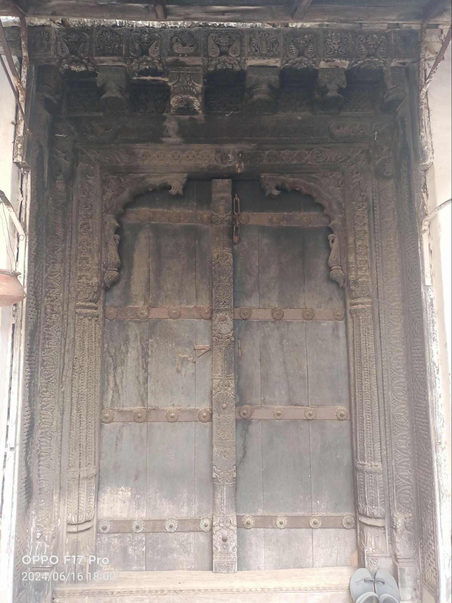 Additional exterior doors reflect a blend of geometric and leaf motifs, with variations in design—one door is more ornate with an arch. (Source: CKA Archives)