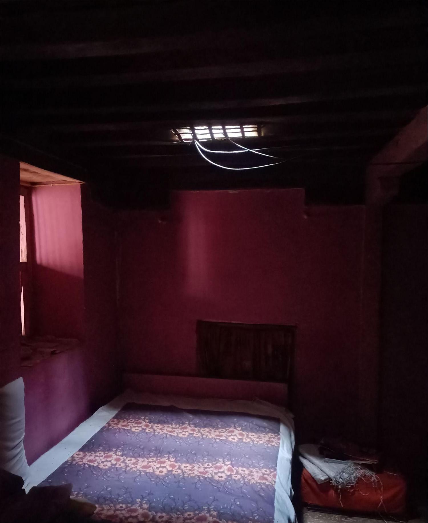 An interior view of ajharoke(orwawne) — a traditional skylight integrated into the ceiling to bring in natural light. (Source: CKA Archives)