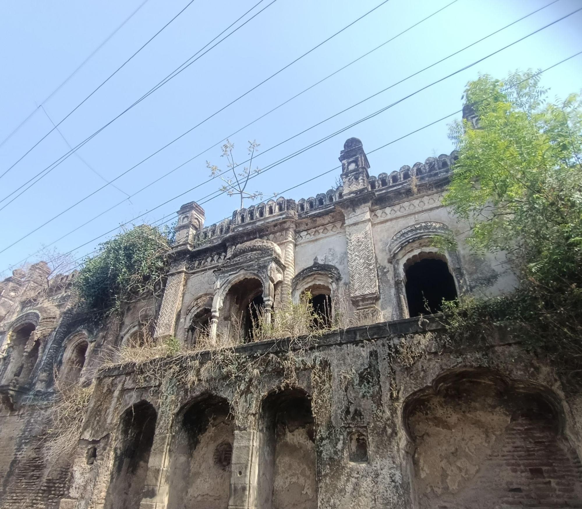 External view of Bebah Bagh, featuring delicate stone carvings and arched windows, highlighting Persian-inspired architectural features. (Source: CKA Archives)