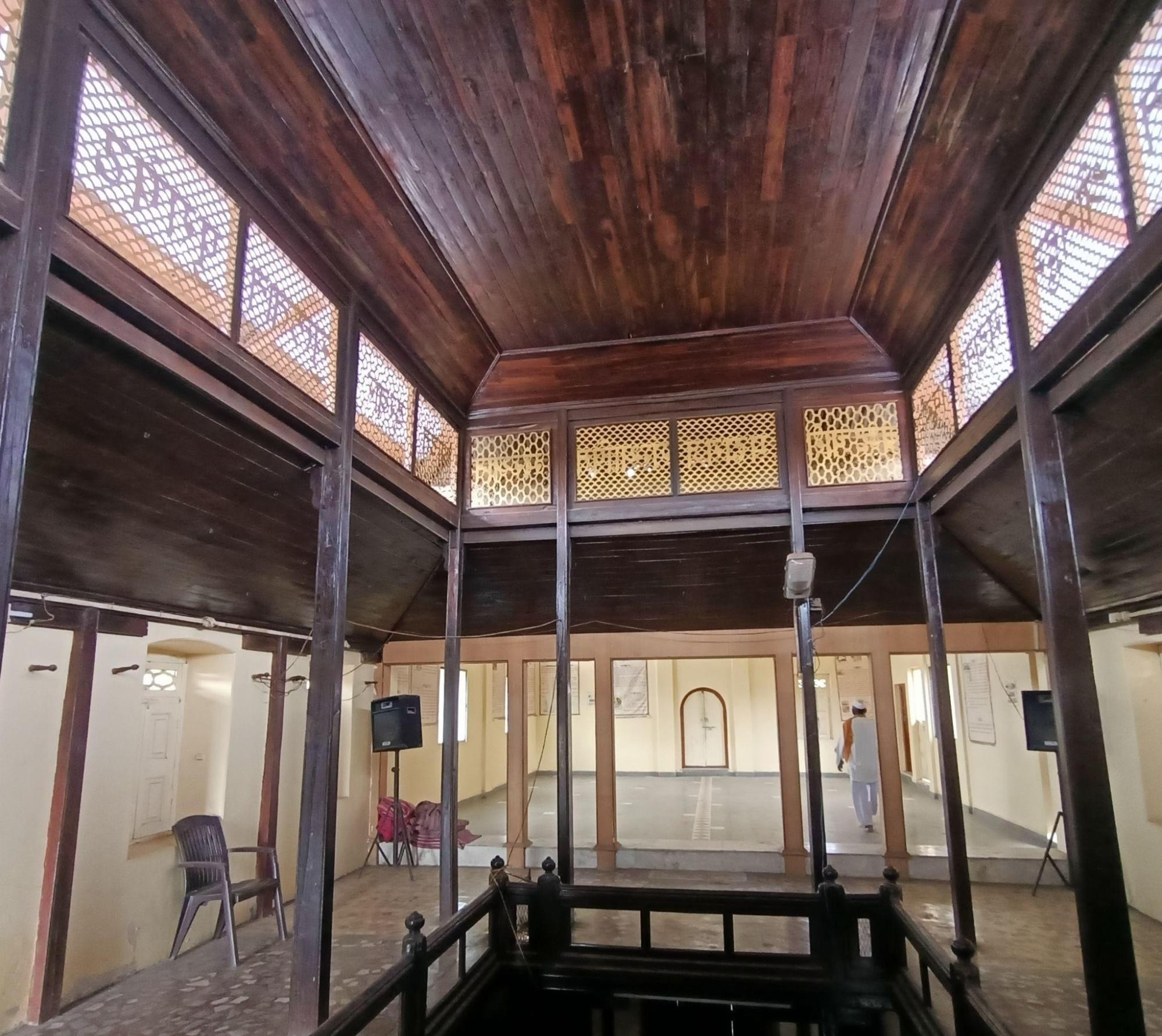 Interior of Datta Mandir revealing its wooden framework and arched passages, part of the Mandir’s labyrinthine architectural design. (Source: CKA Archives)