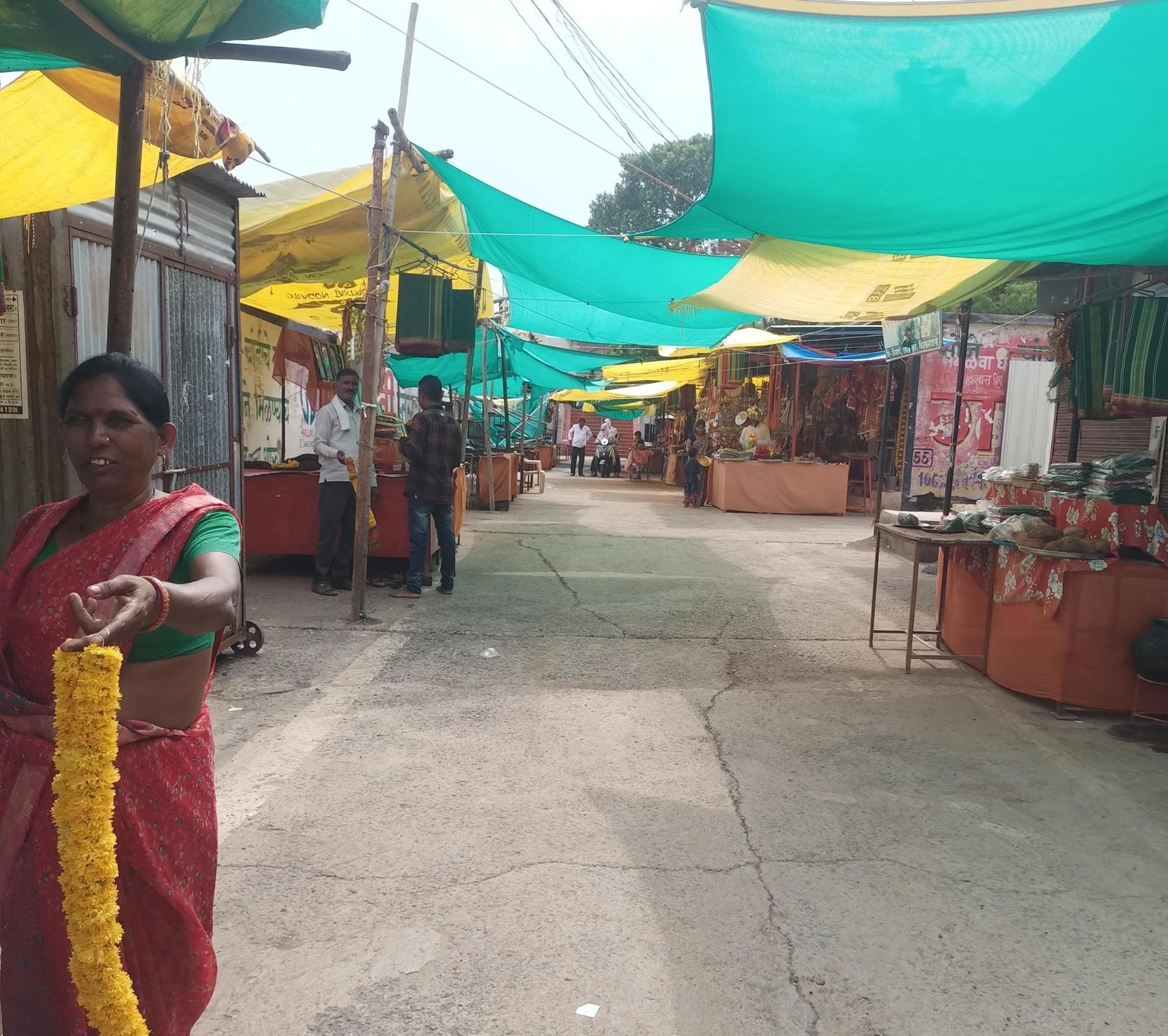 Market outside Jagdamba Devi Mandir, with vendors selling local goods and produce. (Source: CKA Archives)
