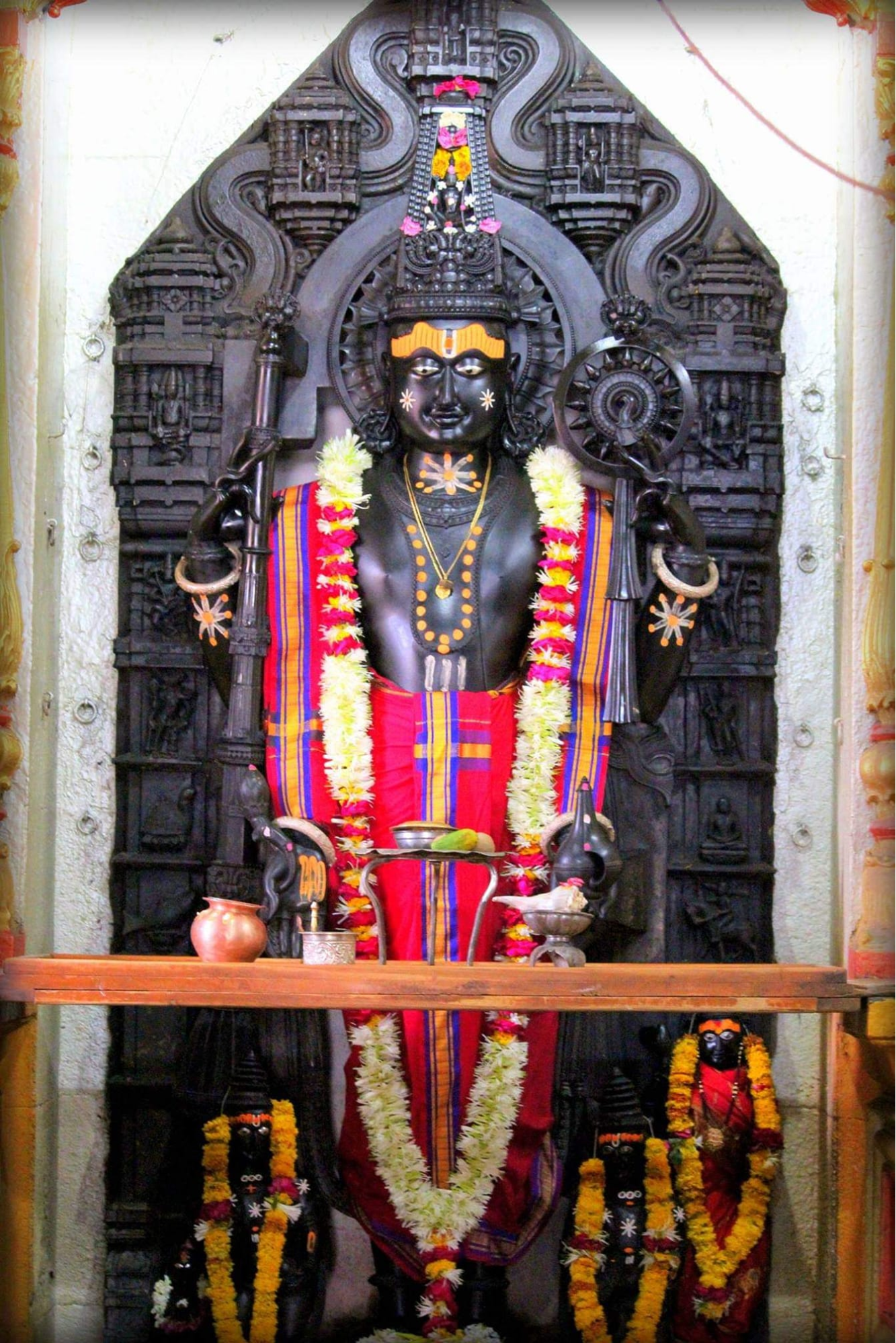 The murti of Sharangadhar Balaji in Buldhana, carved from a single black stone, stands as one of the largest representations of Shri Balaji in Asia.[2]