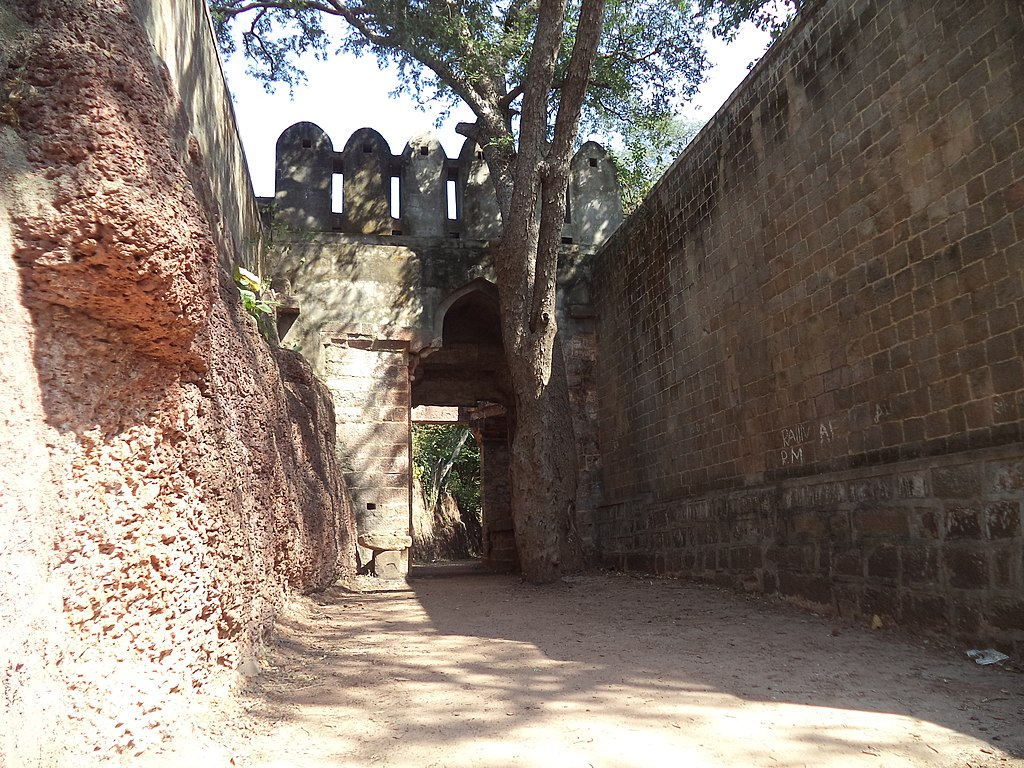 Gateway of Manikgad Fort, whose establishment is associated with early Naga or Mana kings.