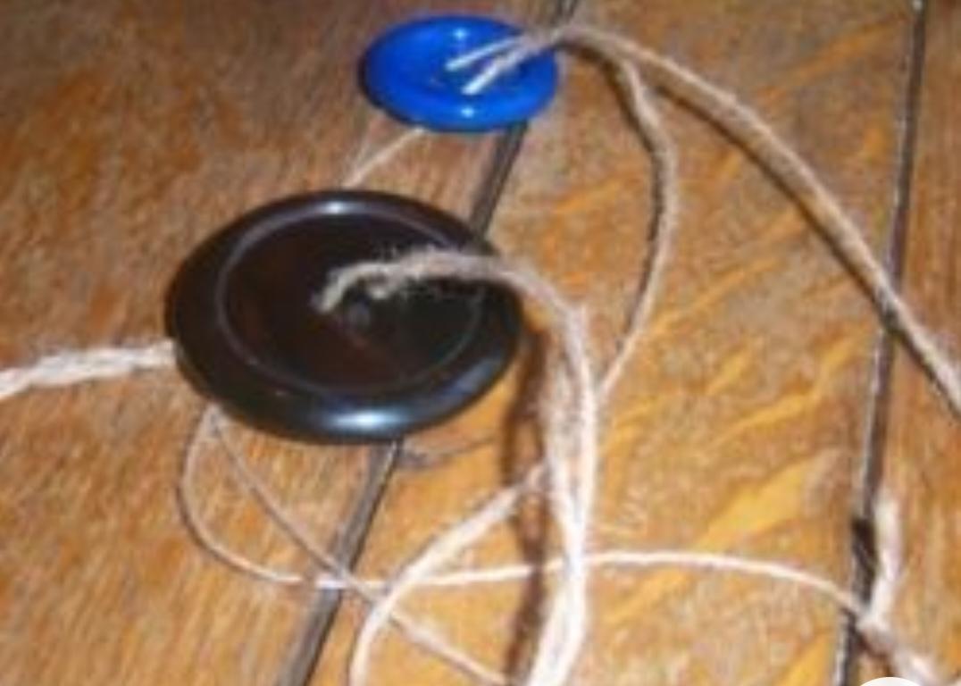 Children often craft spinning toys called "chakri" using caps from Coca-Cola, Pepsi, and other soft drinks. (Source: CKA Archives).