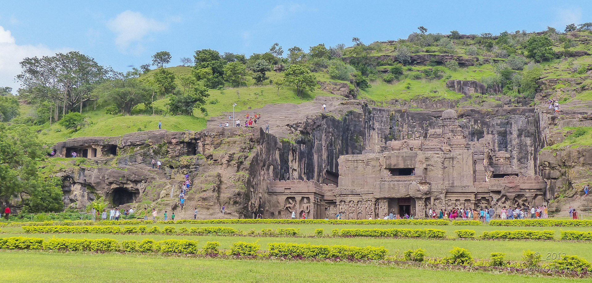 Ellora Caves follow a diverse rock-cut architectural style, carved into the vertical Charanandri hills in a linear north-south alignment.[3]