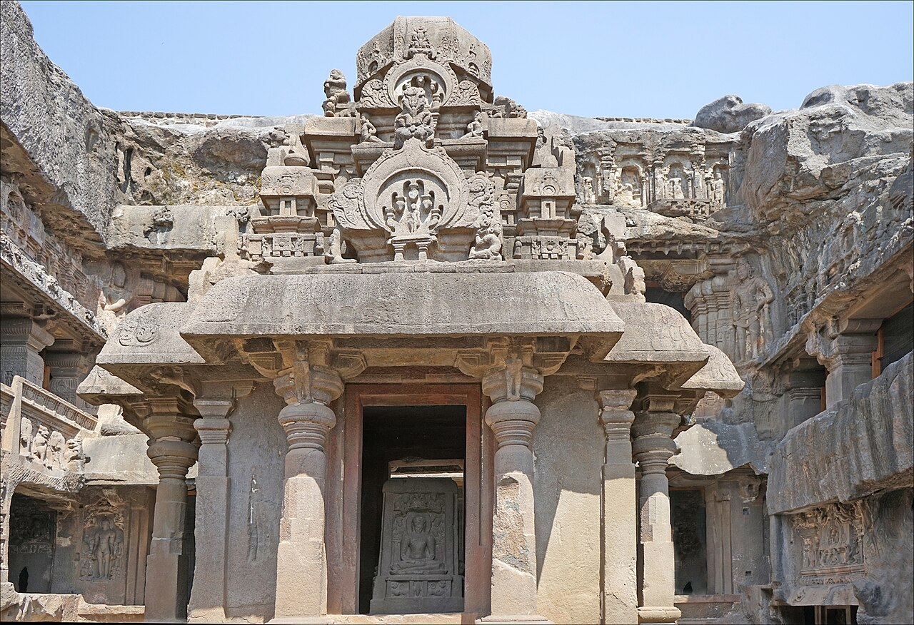 Indra Sabha (Cave 32) in the Jain caves features intricately carved pillars, detailed figural panels, and compact shrines, exemplifying the sect’s focus on both austerity and ornamentation.[6]