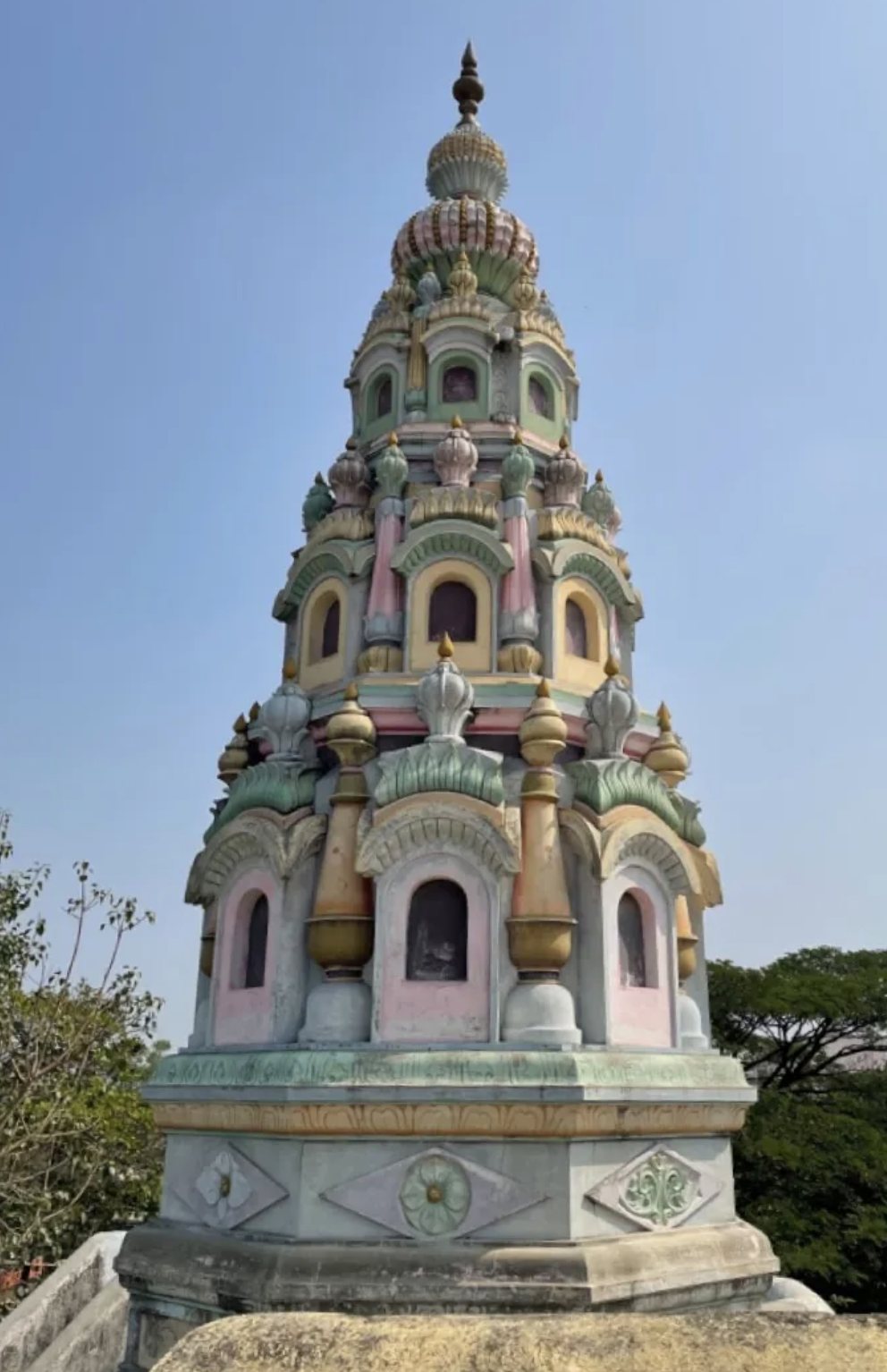 The colourful, pastel coloured spire of Kunthalgiri Mandir in Dharashiv. (Source: CKA Archives)