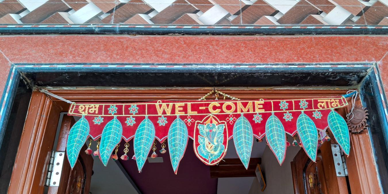 The family living in the house has adorned the entrance with a “toran.” (Source: CKA Archives)