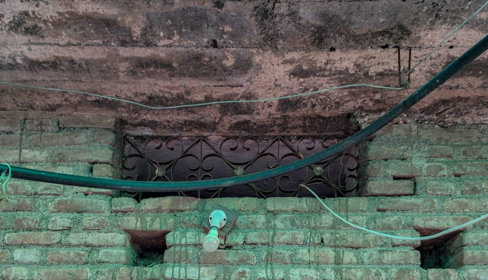 This upper clerestory window has decorative metal grills. Notice how this type of window may facilitate ventilation. (Source: CKA Archives)