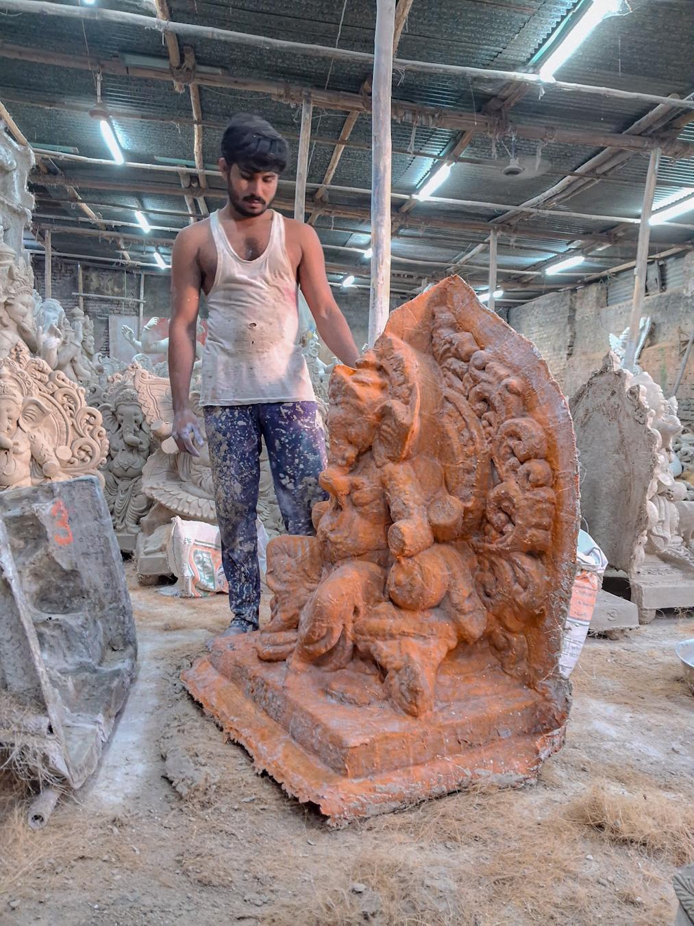 Clay artisan working on Ganesh murtis at a local workshop in Hingoli district. (Source: CKA Archives)