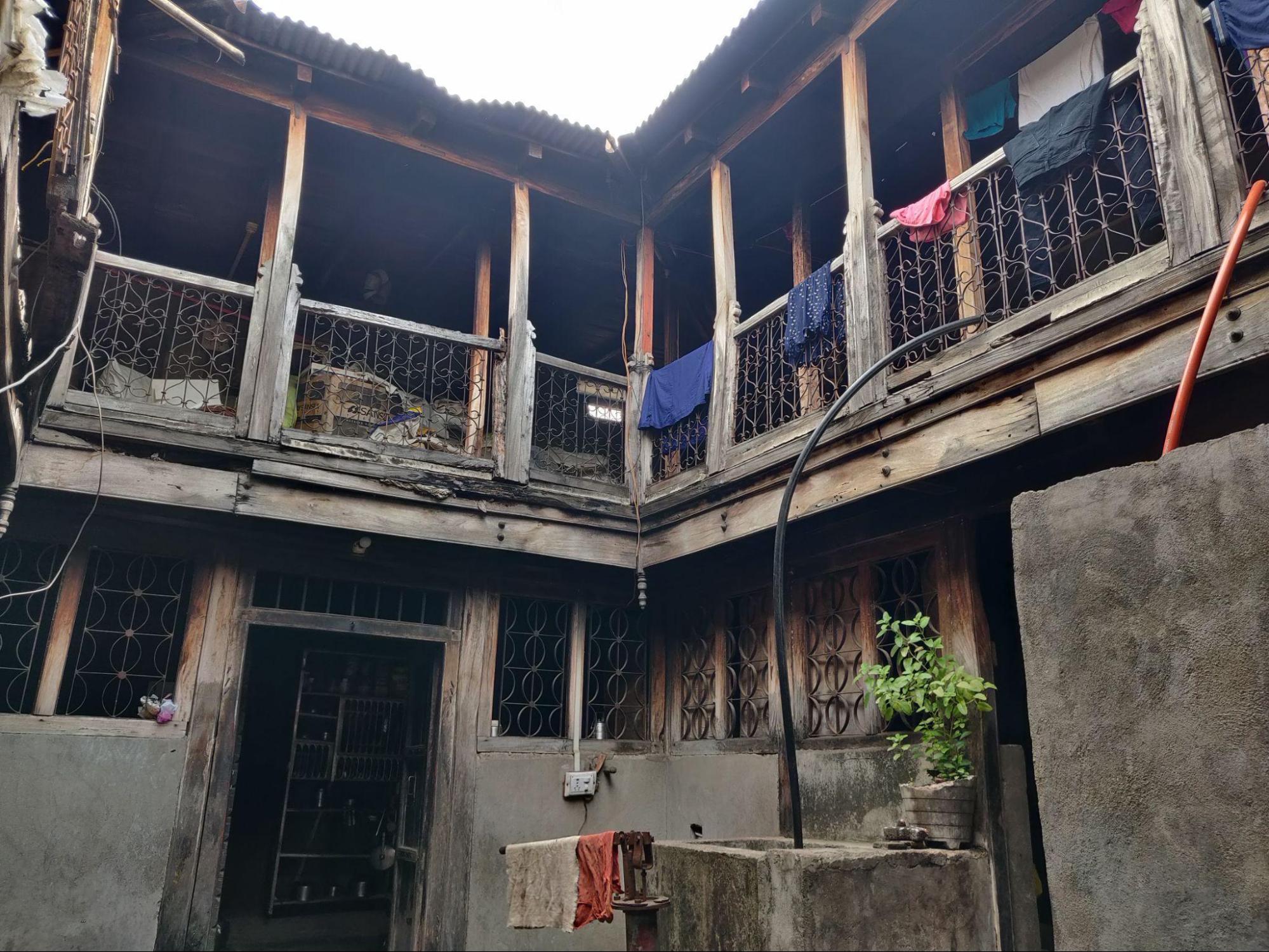 Central courtyard serving as a common space, with rooms opening onto it from all sides. (Source: CKA Archives)