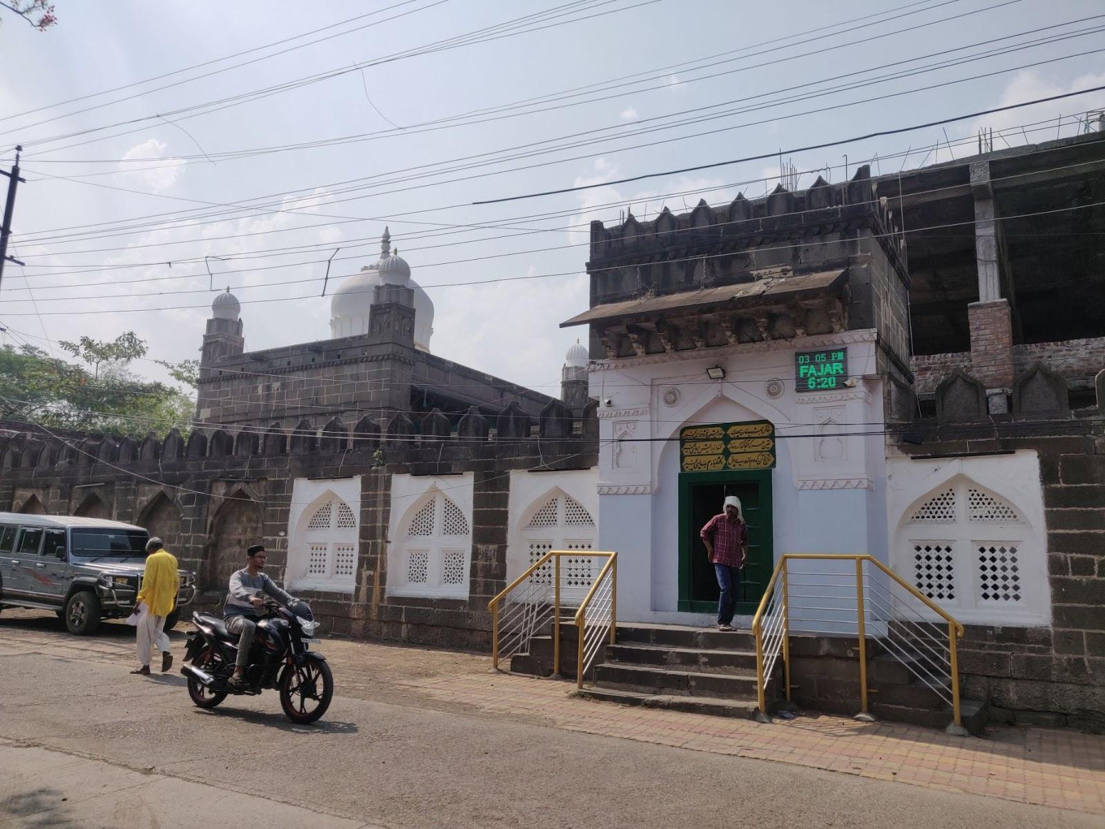 Outside view of Kali Masjid, built from intricately carved black stone. (Source: CKA Archives)