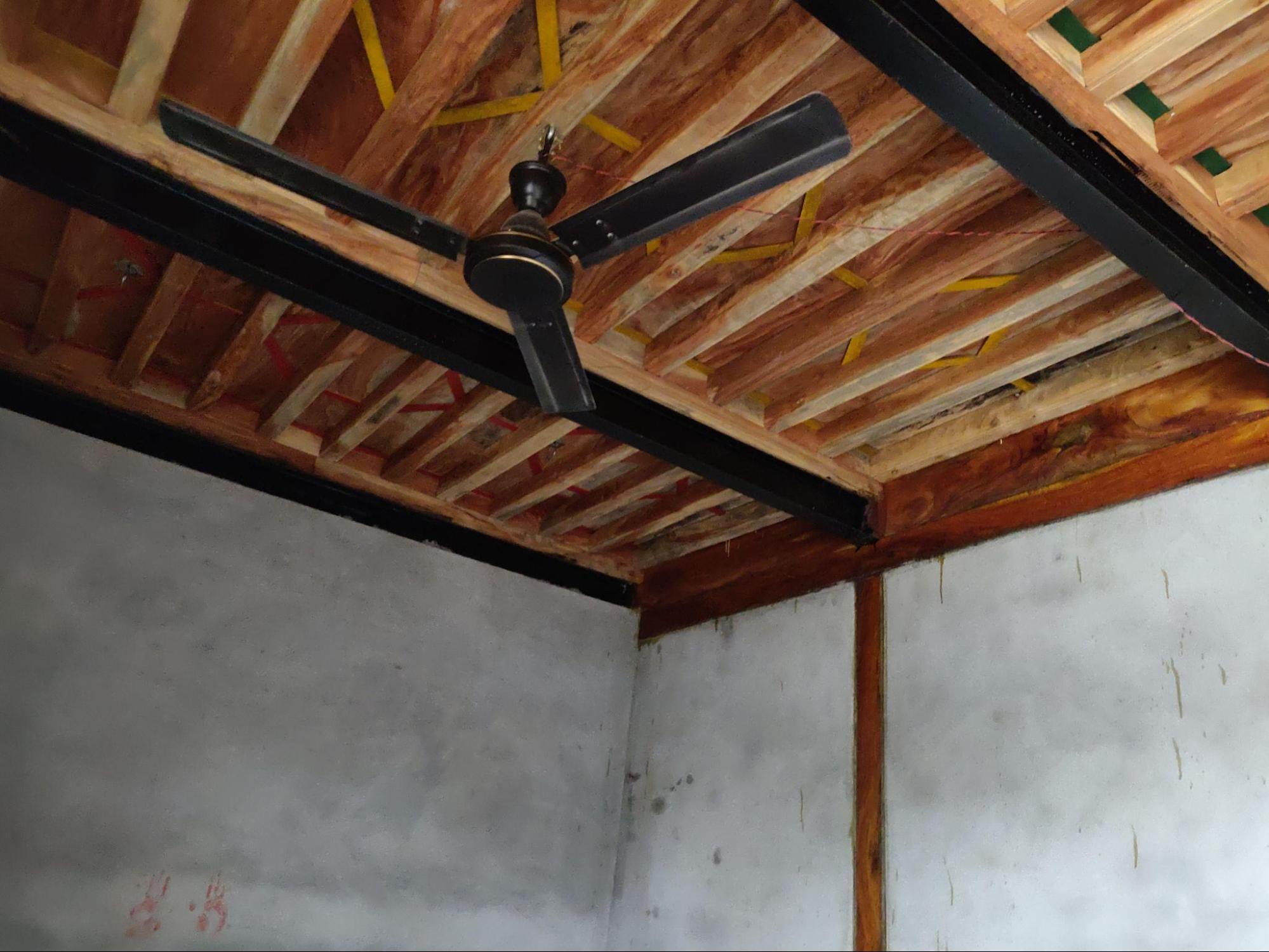 The wooden roof features exposed rafters, continuing the traditional style with locally available materials. (Source: CKA Archives)