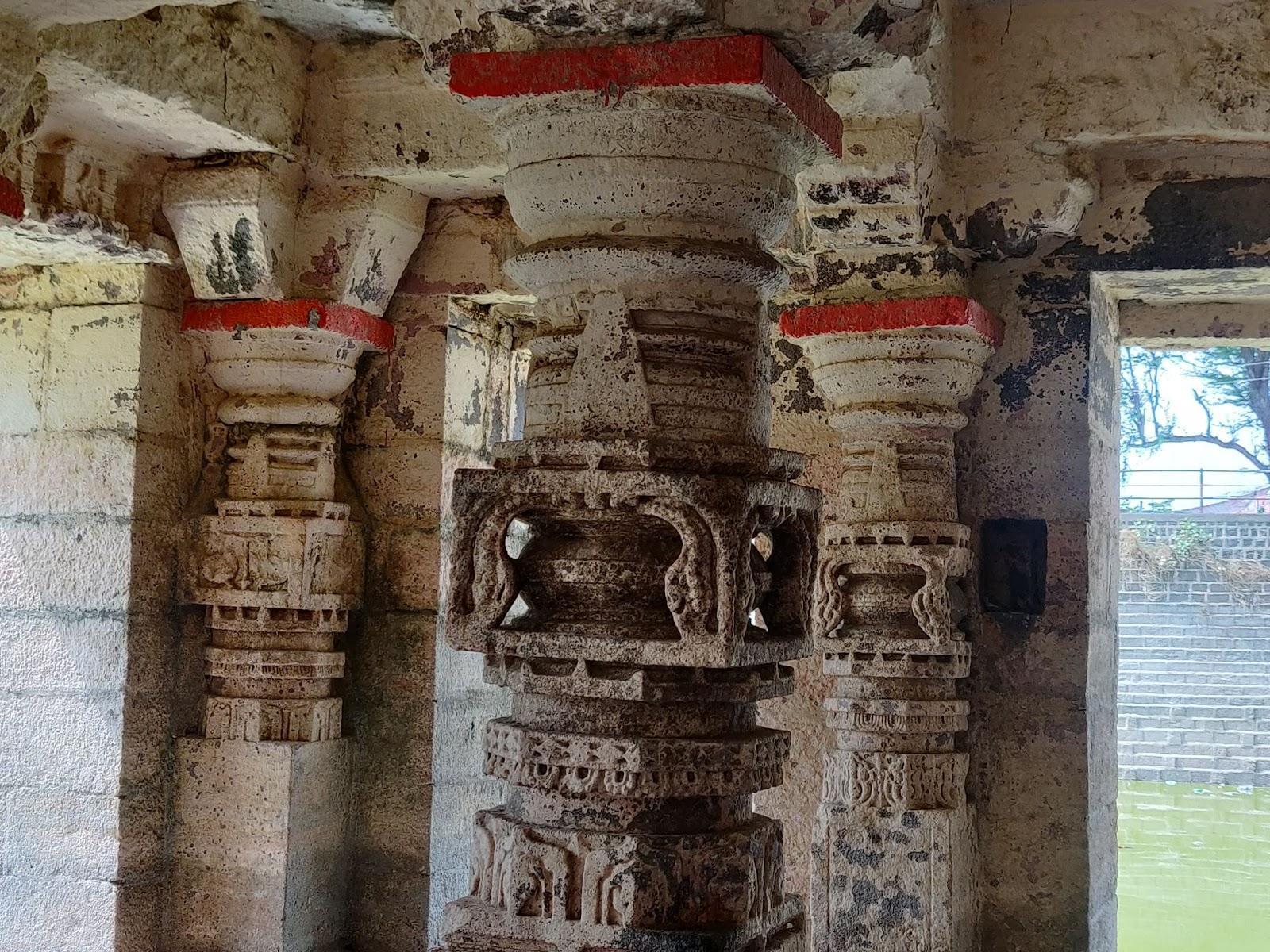 Notice the Intricate carvings on the Stambhs of the Mandir (Source: CKA Archives)