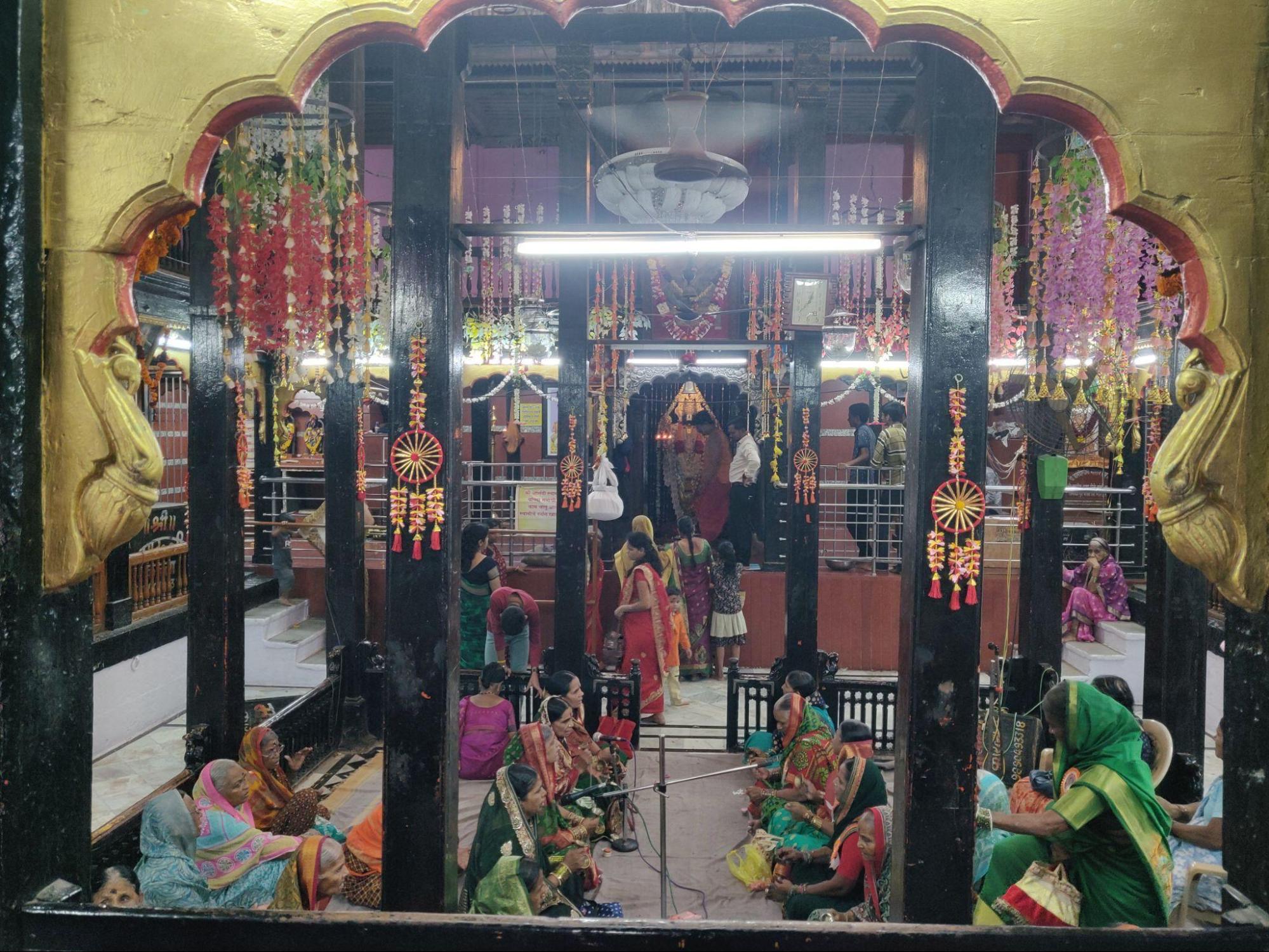 Women performing bhajan in the Anand Swami Mandir (Source: CKA Archives)