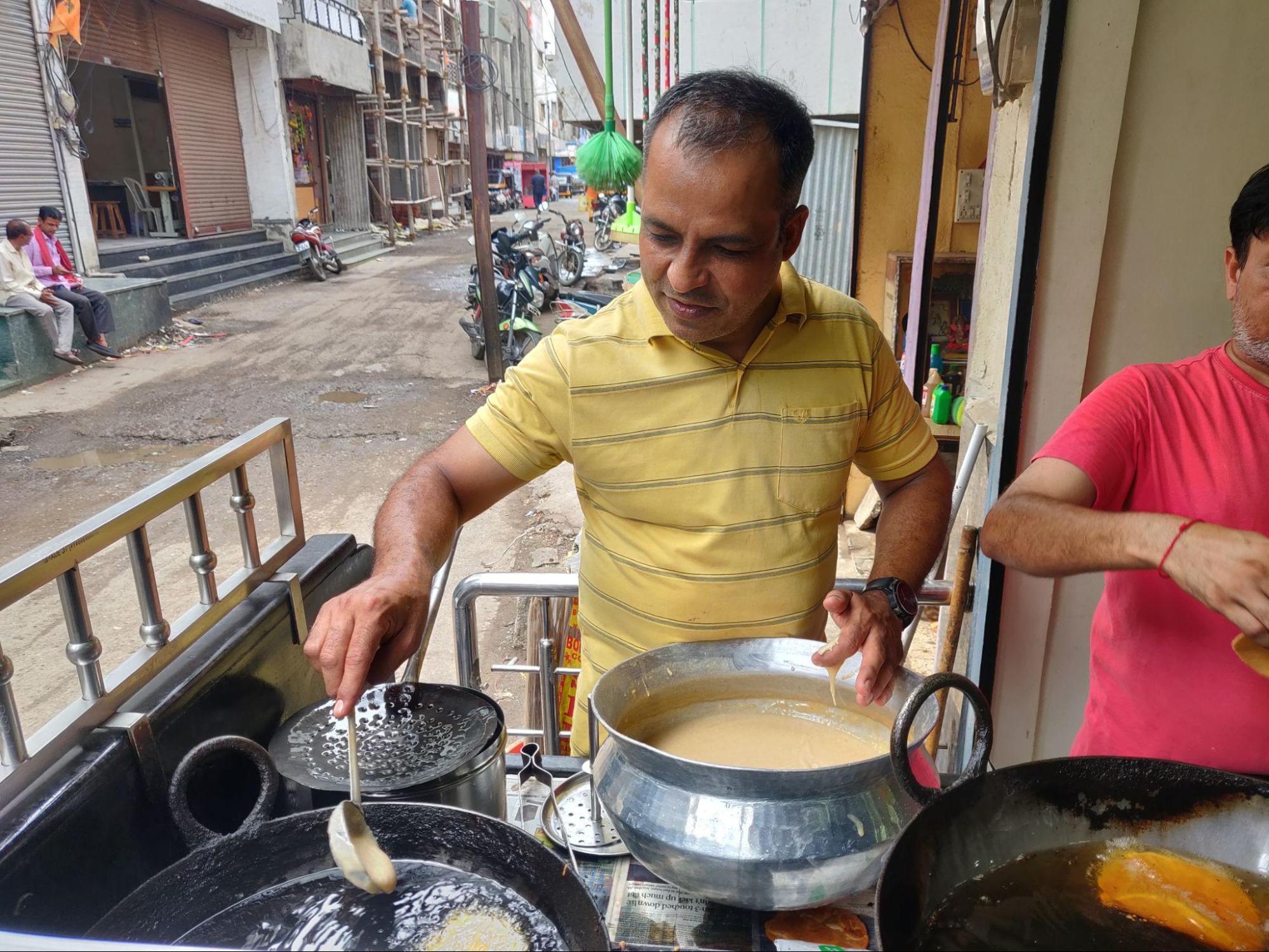 Sindhi Malpua is a sweet dish that holds a special place in Sindhi cuisine. These golden-brown pancakes are made with a batter of flour, milk, and sugar, and then deep-fried to perfection. They are often served with a sweet syrup infused with cardamom and saffron, elevating their flavor to heavenly heights. It is enjoyed on special occasions and festivals, and it's a popular breakfast or dessert option (Source: CKA Archives).