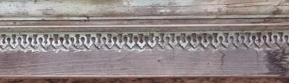 A few motifs can be spotted within the structure with one of them being below the railing. Notice the intricate carvings that may resemble the shape of leaves. (Source: CKA Archives)