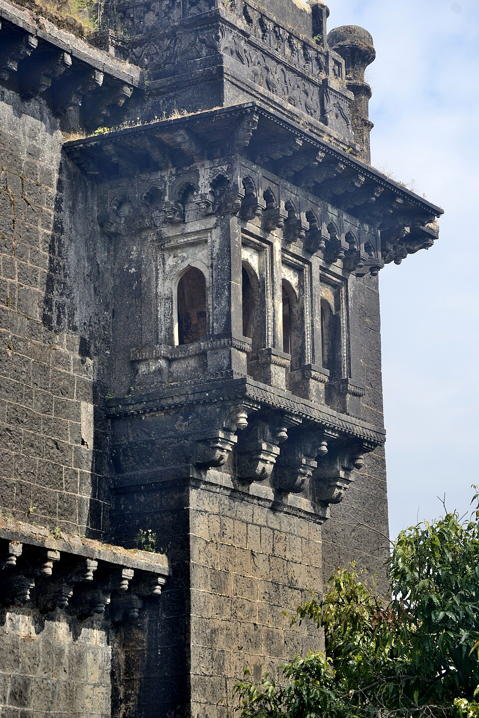 The exterior of Sajjakoti showcases its balcony section, with arched openings, designed for strategic observation and ventilation.[8]