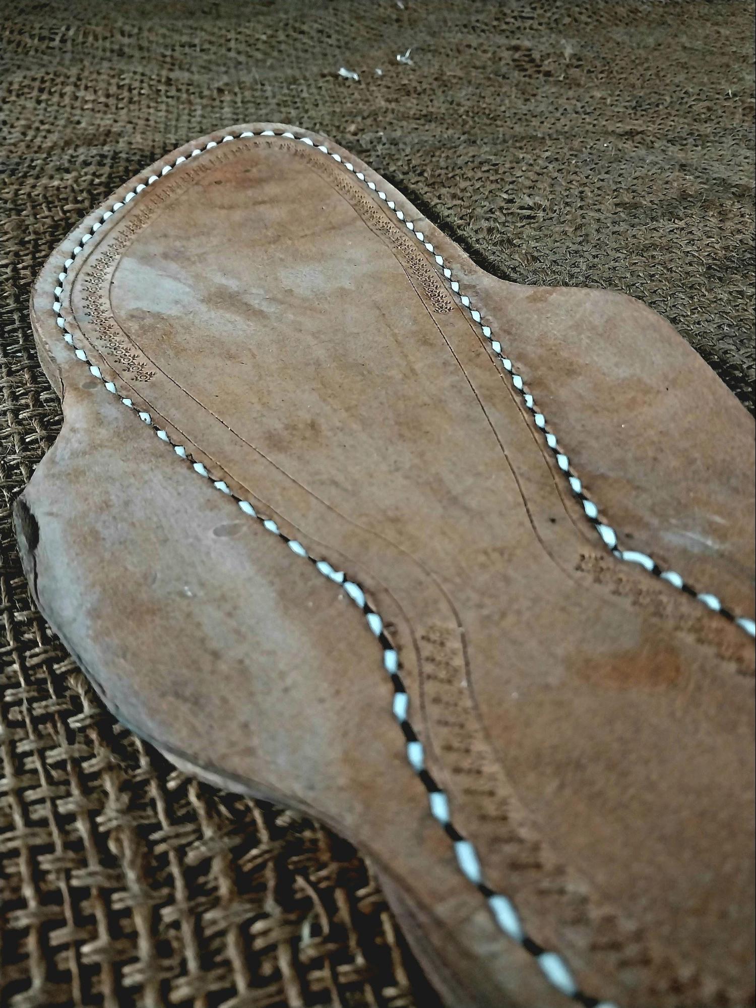 The fully stitched sole forms the foundation on which straps and decorative elements will be added. Source: CKA Archives