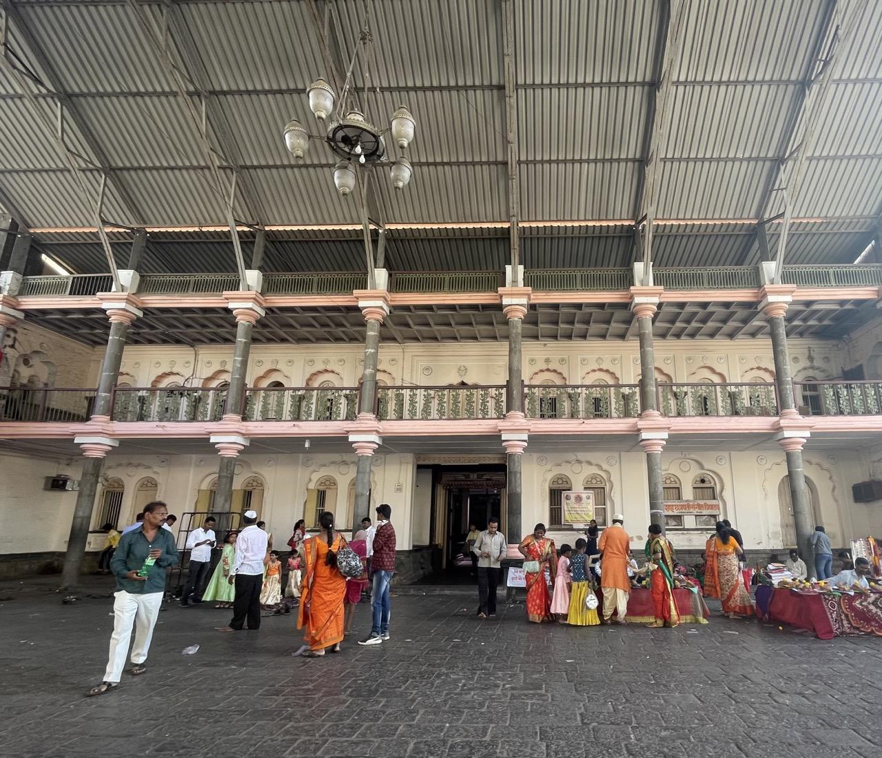 Devotees waiting with the mandir complex.(Source: CKA Archives)
