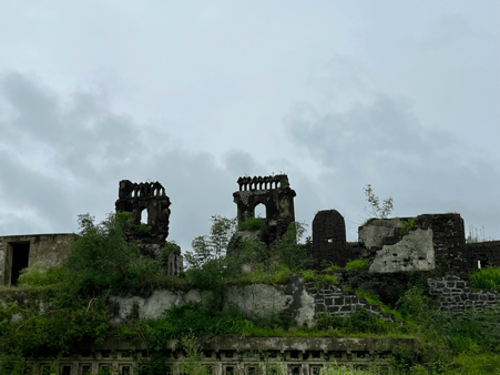 Ruins of the fort structure, featuring weathered stone ramparts and twin arched architectural elements overtaken by vegetation. This well-preserved remnant showcases the region's medieval defensive construction. (Source: CKA Archives)