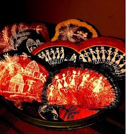 Hand-painted Warli designs on dried mushrooms collected from the forest. Each piece reflects the artist’s connection to the land and the everyday life of the community.[7]