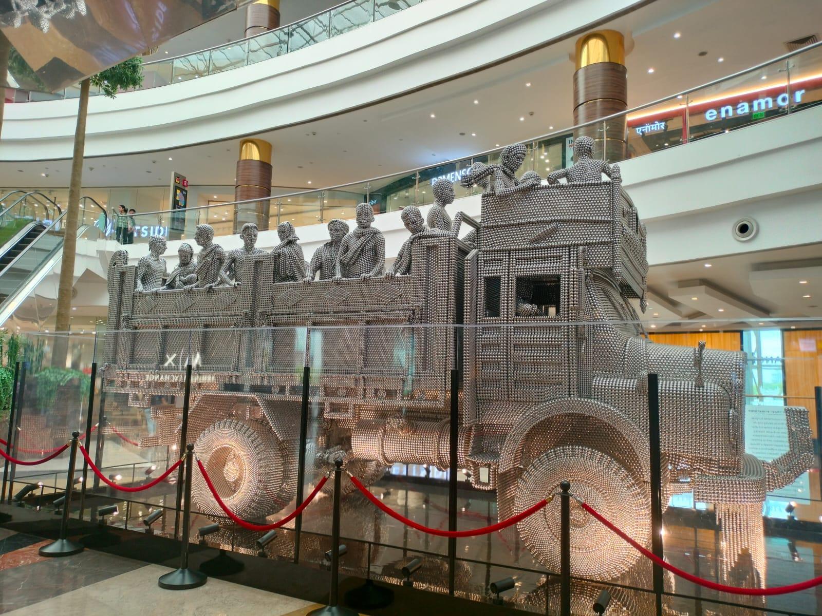 Transit (2010) by Valay Shende, displayed at Phoenix Marketcity, Pune, a life-size truck sculpture composed of reflective metal discs. (Source: CKA Archives)