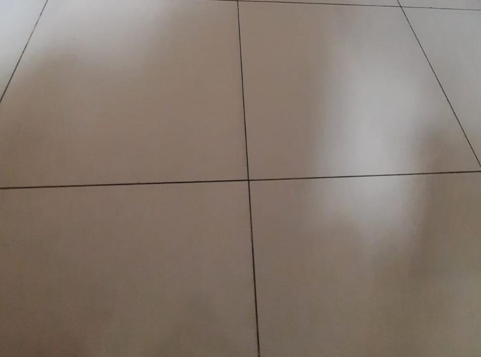 Vitrified cream-colored tiles in the apartments with grout filling at the edges. (Source: CKA Archives)