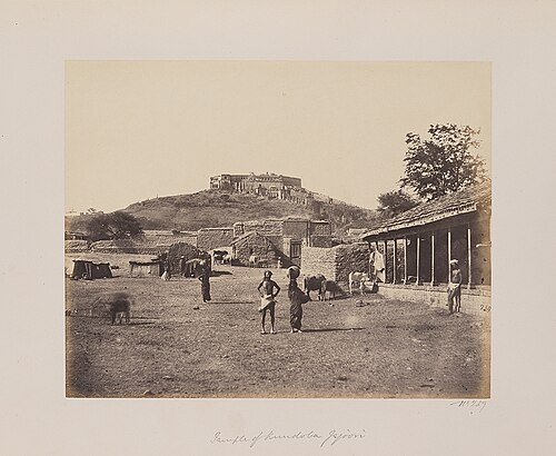 An archival image of Jejuri, showing the village in the foreground and the Khandoba Mandir crowning the hill in the background, dated between 1855 and 1862.[82]