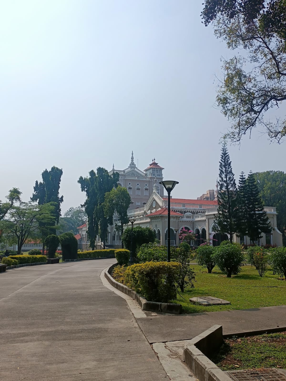Front view of the Aga Khan Palace, Kalyani Nagar, Pune, showcasing its Indo-Saracenic design and landscaped gardens. (Source: CKA Archives)