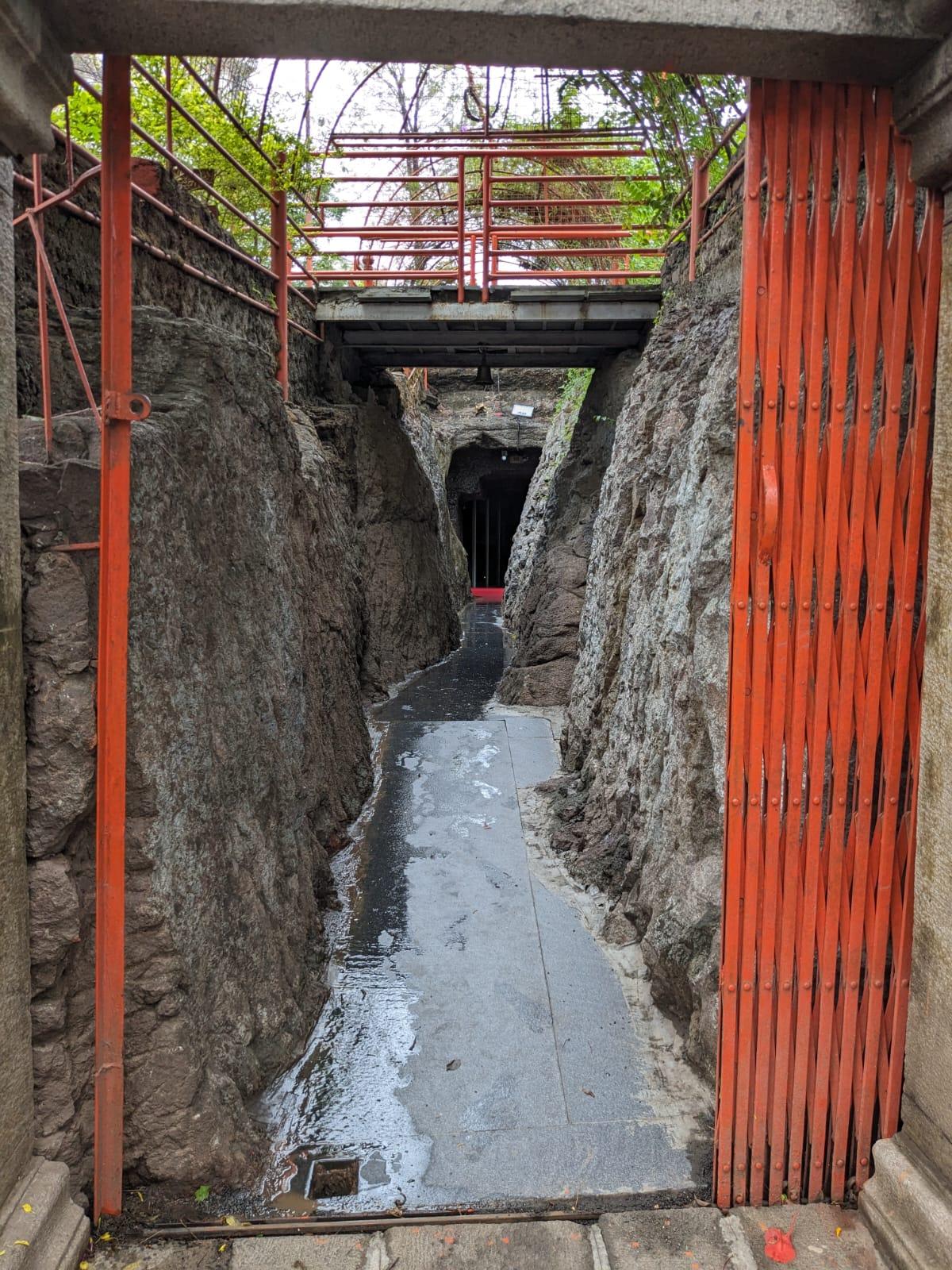 The path leading to the Baneshwar Caves, with natural rock formations visible along the sides. (Source: CKA Archives)