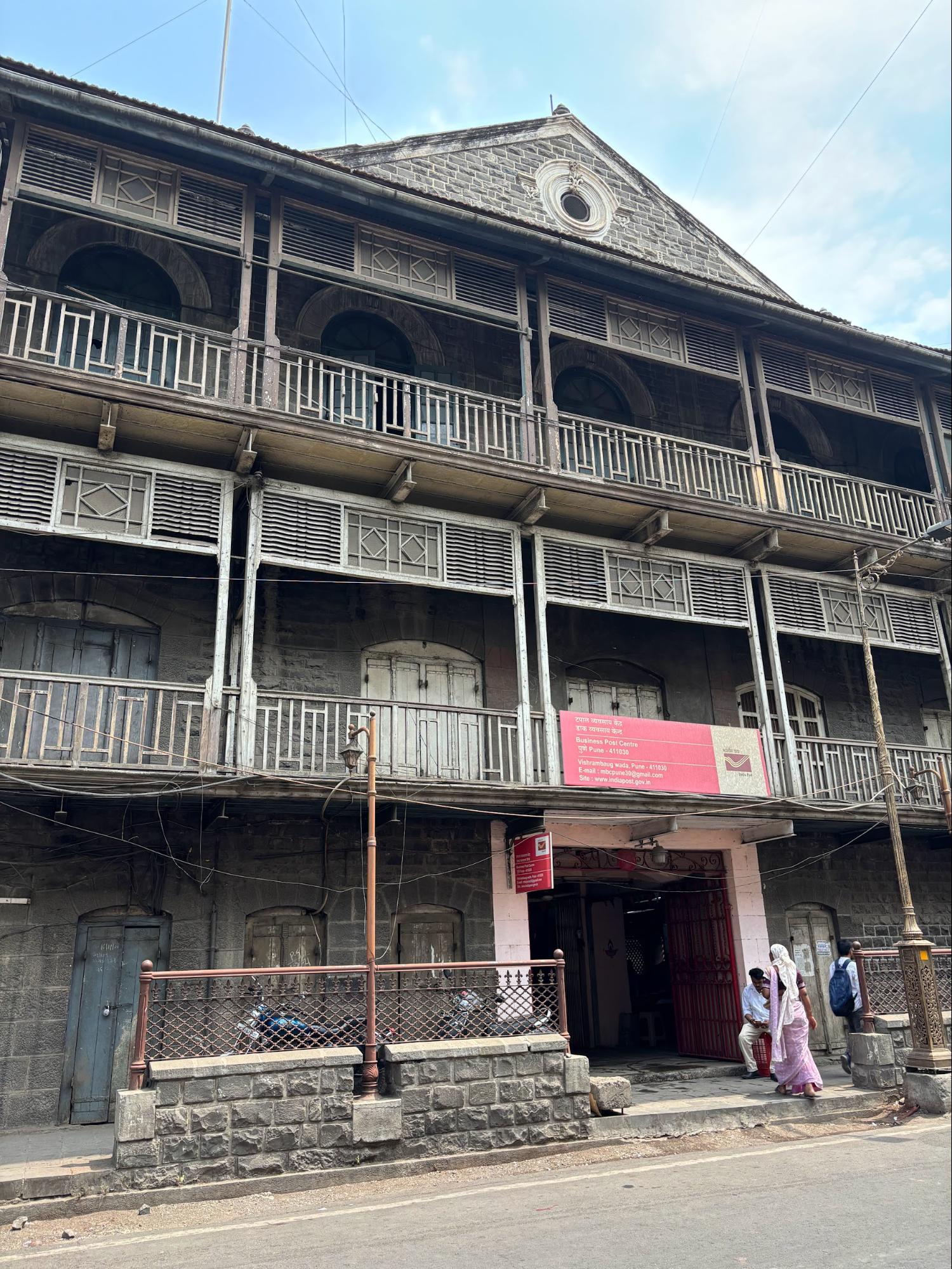 The restored façade of Vishrambaug Wada, featuring elements reconstructed in 2003. The restoration adhered to the original proportions and material practices of early 19th-century Maratha construction. Notably, a part of Vishrambaugwada is being used by the India Post Department as a Business Post Centre. (Source: CKA Archives)
