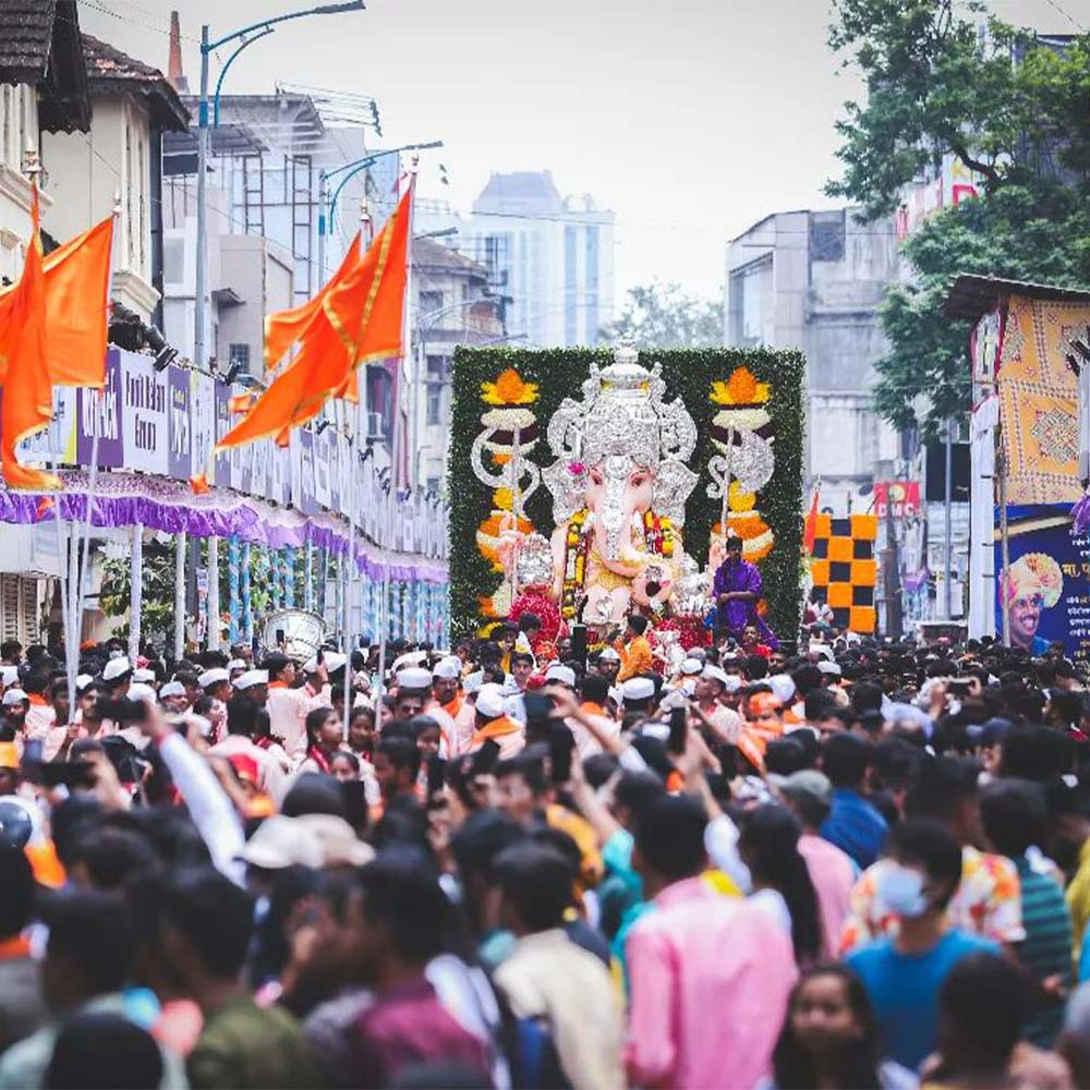 The 13 ft. Tulshibaug Ganpati makes its way through the city during the miravnuk, accompanied by themed decorations and a vibrant procession.[4]