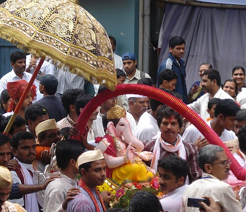 The murti of Kasba Ganpati,Pune’s Gram Daivat and the first of the Maanache Ganpati,leads the immersion procession, carried in a traditional palanquin.[3]