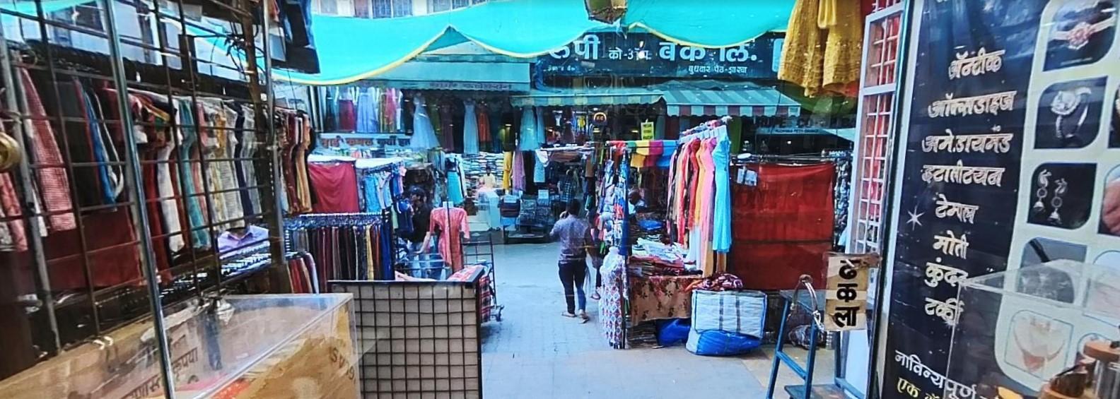 Rows of traditional shops in Tulsi Baug sell brassware, clothing, cosmetics, and puja items, drawing shoppers from across the city. (Source: CKA Archives)