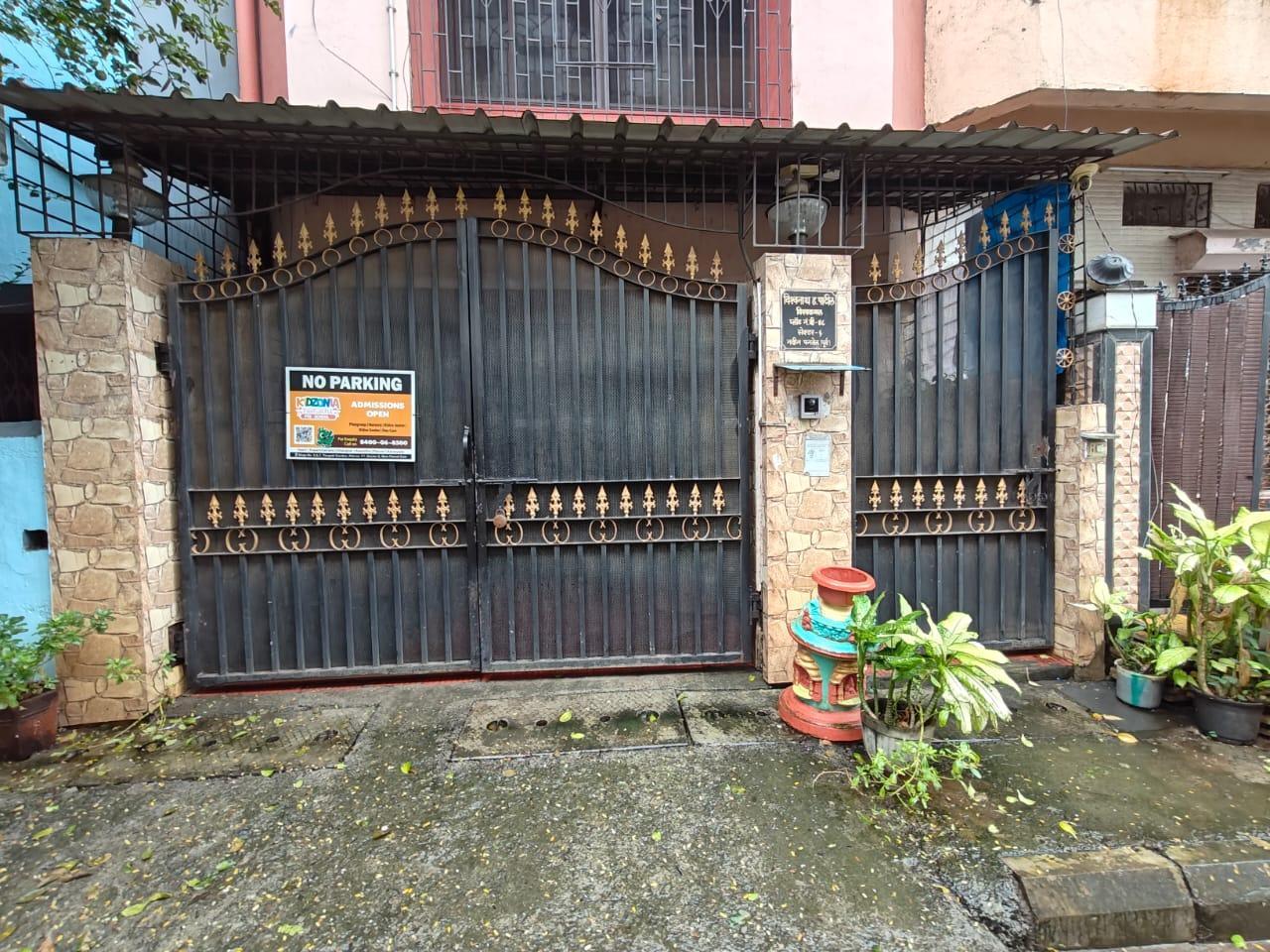 Street-facing facade with integrated metal entrance gate featuring decorative spikes. The gate structure establishes the boundary between public and private space while maintaining visual connection with the streetscape. (Source: CKA Archives)