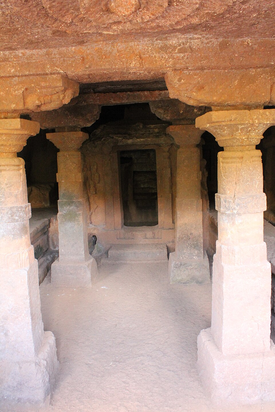 Stone pillars inside the Panhalakaji Caves show simple structural design typical of early Buddhist excavation, later adapted for Nath and Shaiva use.[2]