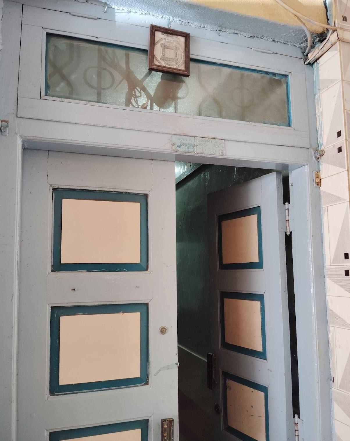 Wooden, double-paneled door leading to the hall. (Source: CKA Archives)