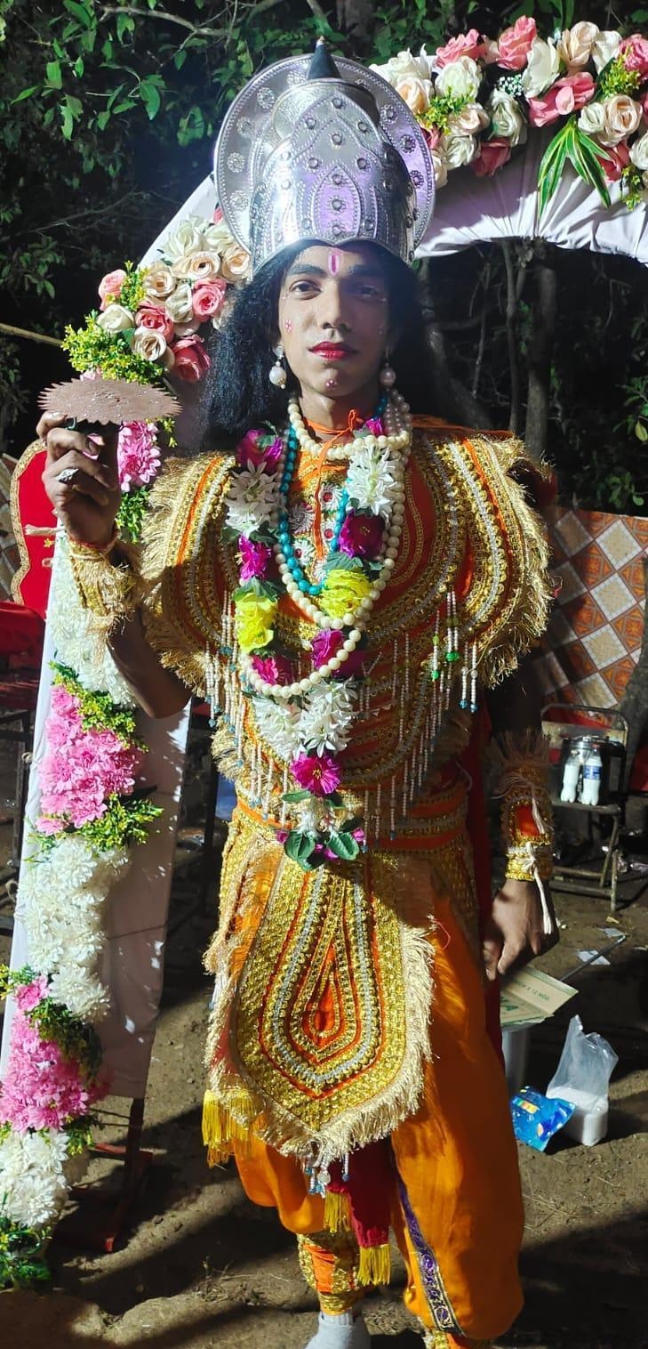 An actor in ornate costume plays Krishna or Vishnu, ready to enter the stage. (Source: CKA Archives)