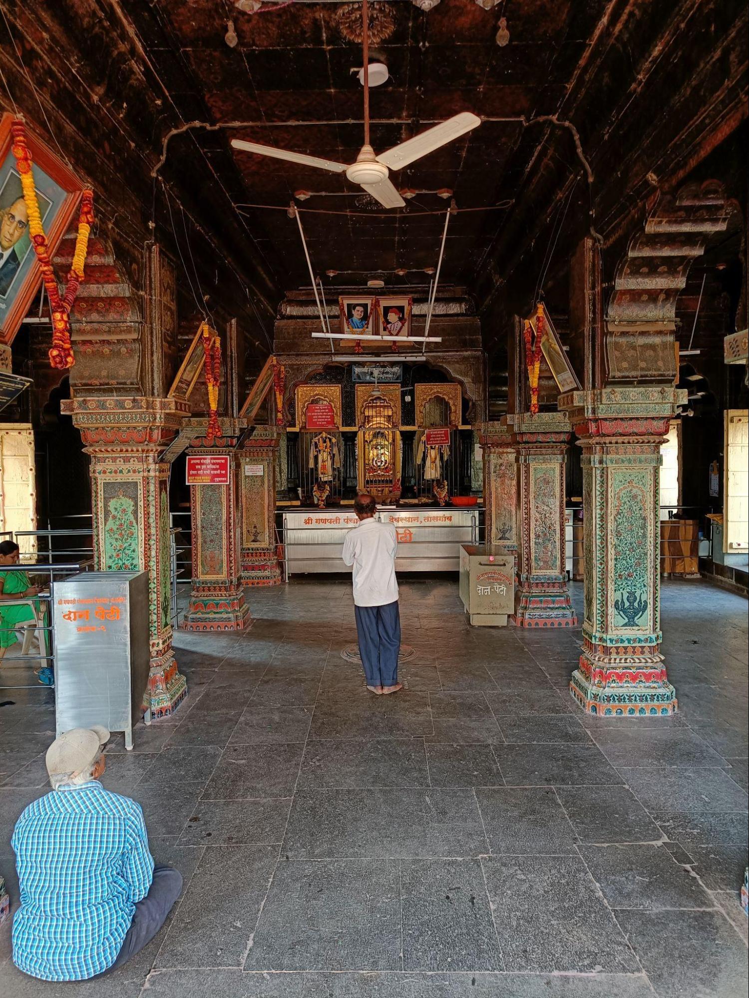 The beautiful garbhagriha of the Tasgaon Ganpati Mandir where Rajasthani paintings adorn the ceiling walls and portraits of the famous Patwardhan family can be found. (Source: CKA Archives)