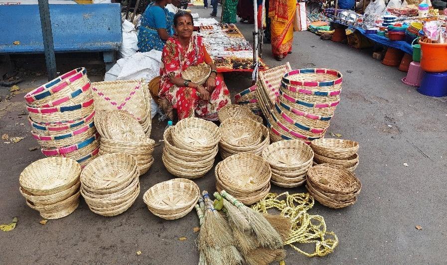 A vendor selling baskets made out of bamboo at Burud Galli. (Source: CKA Archives)