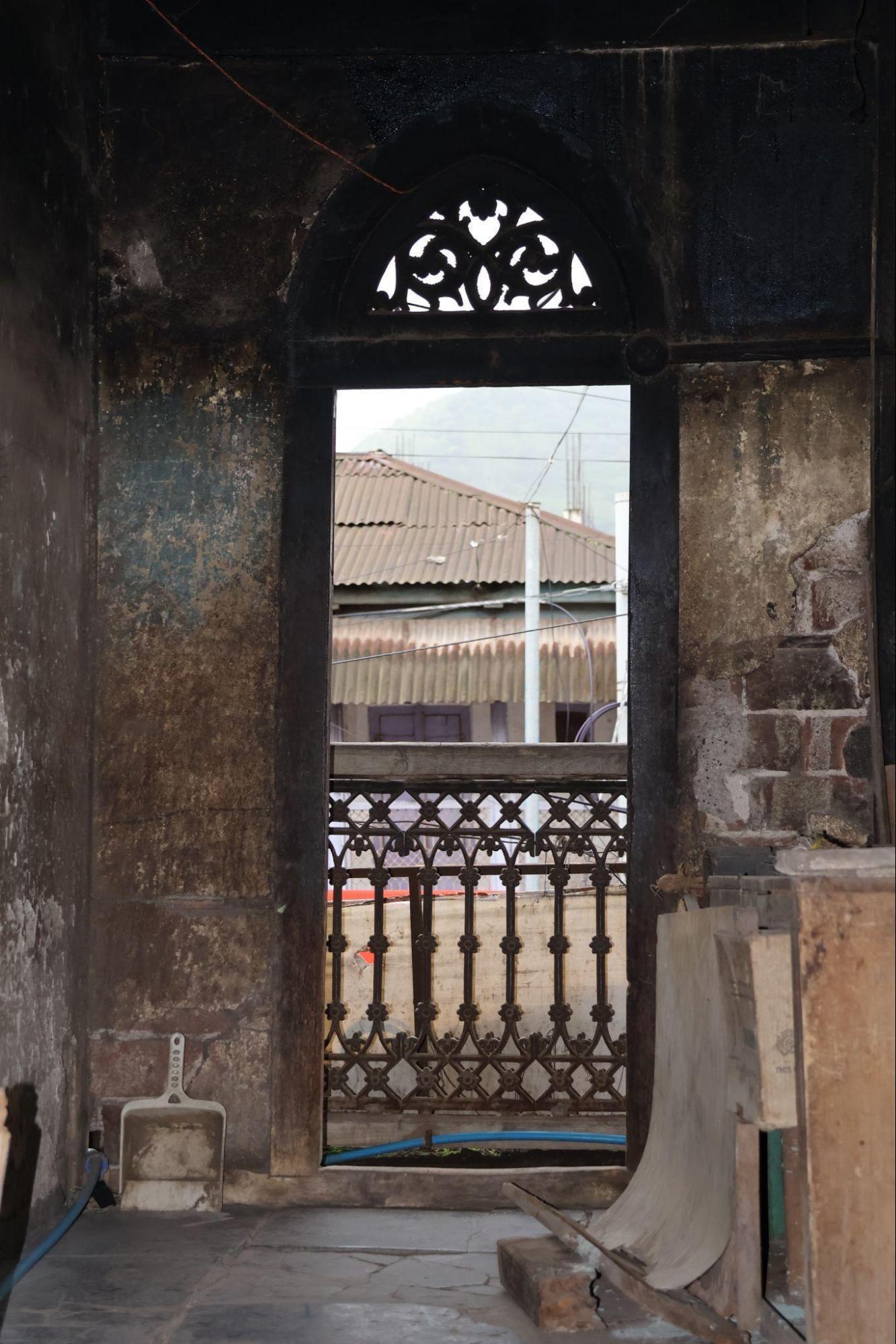Balcony doors with timber arches and detailed woodwork, distinct from the design of the doors of the ground floor.(Source: CKA Archives)