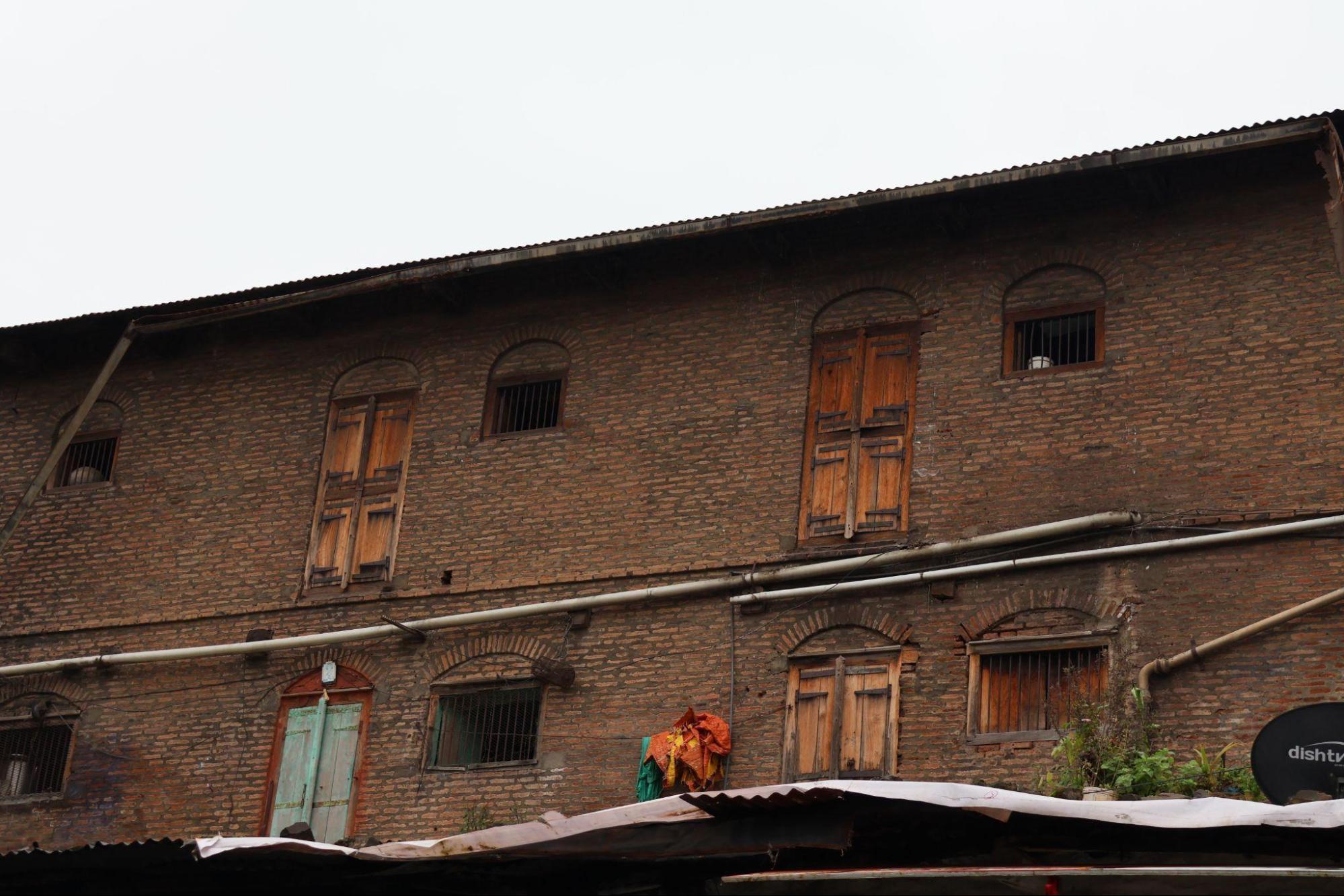 High-set rear windows with iron grills. Their placement reflects functional needs rather than ornamentation.(Source: CKA Archives)