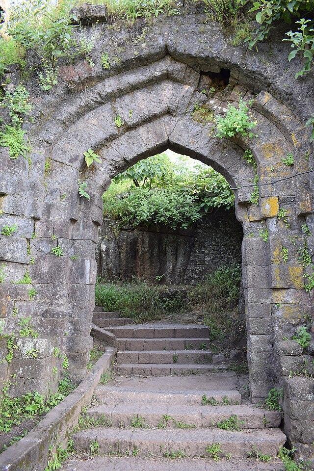 Shambhu Mahadev Mandir, Shikhar Shingnapur—stone-built Mandir with carved spire, housing twin Shivlings representing Shiv and Parvati.[3]