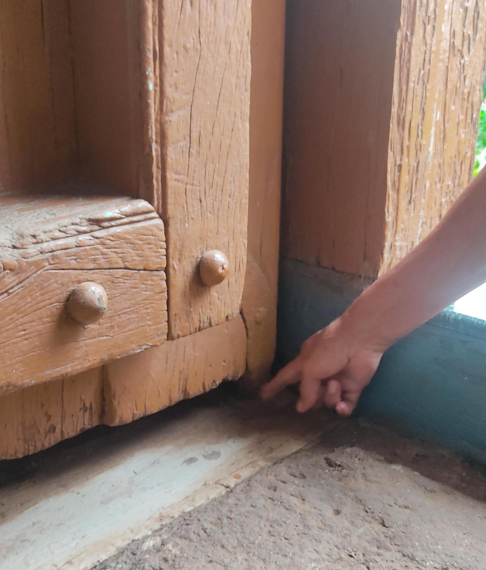 Wooden door of the entrance. The spikes act as embellishment, while also providing protection. (Source: CKA Archives)